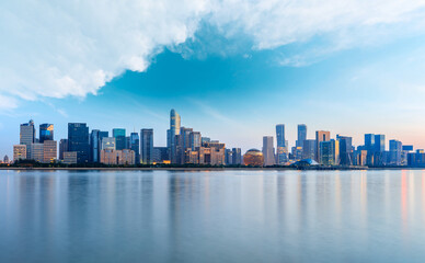 Fototapeta na wymiar Hangzhou city skyline and architectural reflections at sunrise,China.