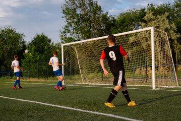 Obraz premium Soccer player kicks the ball.Soccer player takes a corner kick