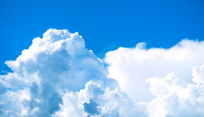 Naklejka na ściany i meble Clouds. Blue sky background with fluffy clouds 