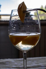 In the foreground a percoca bathed in wine.