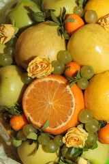 Fruit and floral green bouquet with apples and citrus