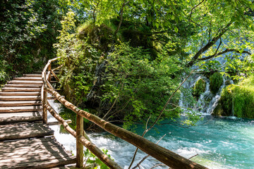 Naklejka premium Picturesque morning in Plitvice National Park. Colorful spring scene of green forest with pure water lake. Great countryside view of Croatia, Europe
