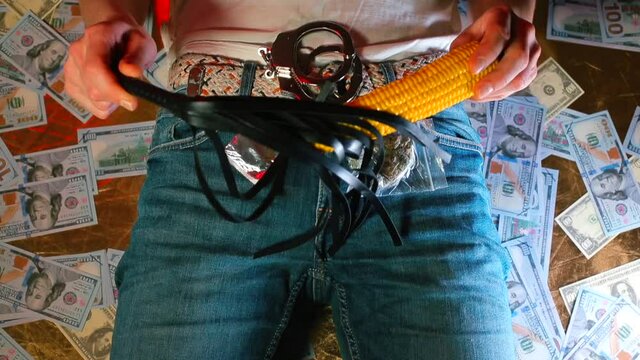 Sex toy and narcotic marijuana. Close-up. Male dominant shows a set for the psychological unloading of a person. 