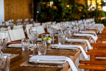 Table setting for a party or wedding reception in a restaurant.