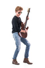 Side view of red hair rocker playing electric guitar with sunglasses looking down. Full length portrait isolated on white background. 