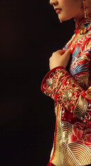 Asian girl wearing red republican dress in dark background