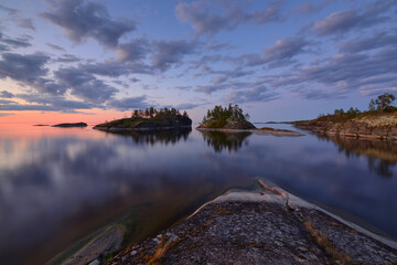 Calm and white night on the lake with Islands