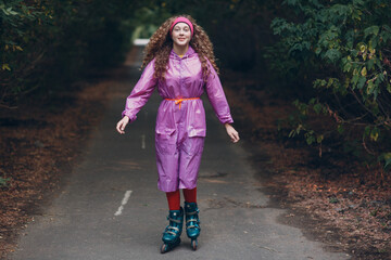 Young curly woman going roller skate at park.