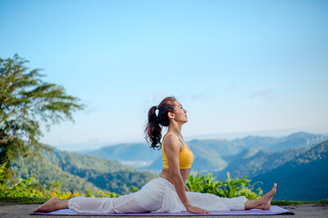Healthy woman yoga lifestyle balanced practicing meditate and energy exercise sport yoga outdoors...