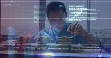 Data processing against male architect making building model - Powered by Adobe