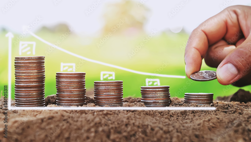 Poster saving money hand putting coins on stack on soil with sunshine. concept finance and accounting