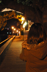 Woman walking in the lane at night