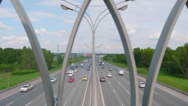 Time laps of up view of traffic on Moscow ring highway from the bridge above it.