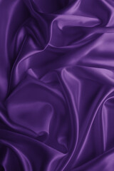 Beautiful elegant wavy violet purple satin silk luxury cloth fabric texture with violet background design. Card or banner. 