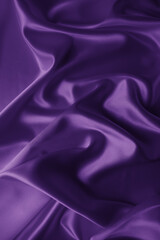 Beautiful elegant wavy violet purple satin silk luxury cloth fabric texture with violet background design. Card or banner. 