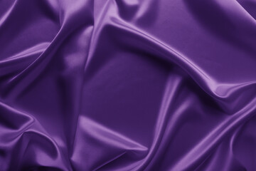 Beautiful elegant wavy violet purple satin silk luxury cloth fabric texture with violet background design. Card or banner. 