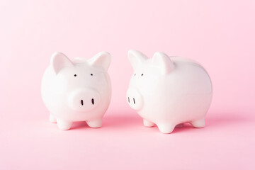 International Friendship Day, Front two small white fat piggy bank, studio shot isolated on pink background and copy space for use, Finance, deposit saving money concept