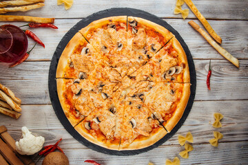 Capricciosa pizza with chicken fillet mushrooms