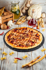 Barbecue pizza pepperoni red onion and mozzarella