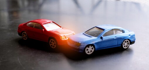 Plakat Toy cars crash accident. Simulation red and blue car
