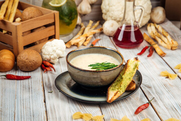 Potato soup with cream and smoked horsemeat