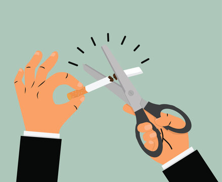 Businessman hands holding Scissors cutting a cigarrette