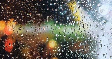 View on night airport through airplane window with raindrops. Night wallpaper