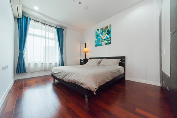 White pillows on wooden bed in minimal bedroom interior