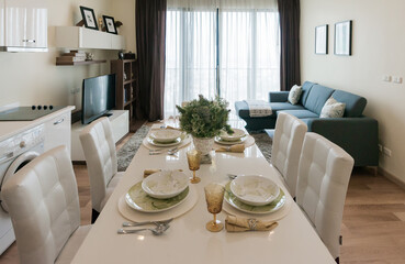 Stylish kitchen interior with dining table and chairs