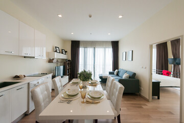 Stylish kitchen interior with dining table and chairs