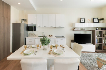 Stylish kitchen interior with dining table and chairs