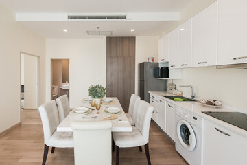 Stylish kitchen interior with dining table and chairs