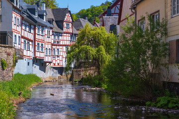 Fototapeta na wymiar Traditional half-timbered houses on the Elzbach creek in Monreal / Germany in the Eifel