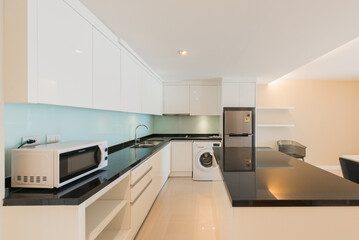 Modern kitchen interior with electric and microwave oven
