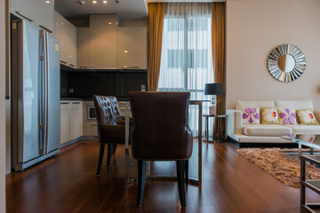 Stylish kitchen interior with dining table and chairs