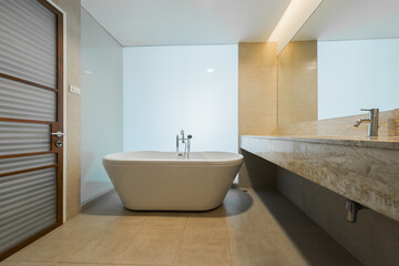 Fototapeta na wymiar Luxury bathroom toilet bowl and bathtub , vintage color tone style