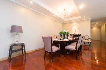 Stylish kitchen interior with dining table and chairs