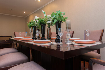 Stylish kitchen interior with dining table and chairs