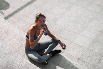 Sportswoman drinking water