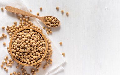 top view of soybean or soya bean in a bowl on white wooden background