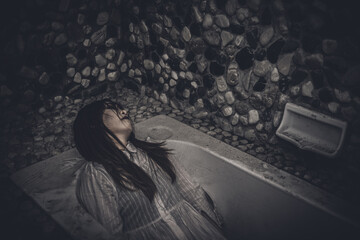 Portrait of asian woman make up ghost face with blood,Horror scene,Scary background,Halloween...
