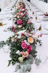 Beautiful wedding bouquet. Delicate petals of white and red roses.