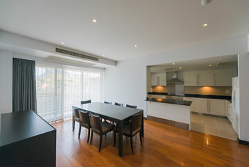 Stylish kitchen interior with dining table and chairs