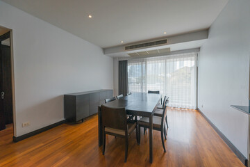 Stylish kitchen interior with dining table and chairs