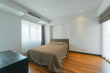 Bright Interior of cozy bedroom in modern design