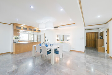 Stylish kitchen interior with dining table and chairs