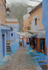 Street with stairs in Medina of Chefchaouen, Morocco. Chefchaouen or Chaouen is known that the houses in this old town are painted in the striking, variously blue hued
