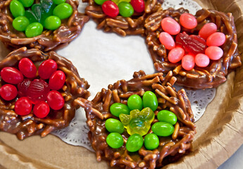 This plate of no bake Christmas cookies is a dish of holiday goodies in red and green.  Pretzels, jelly beans and gummy candies are in these chocolate cookies.