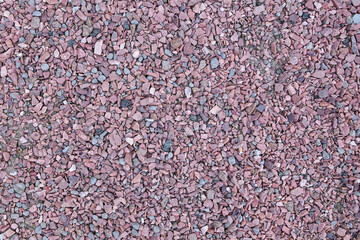 Pink crushed stone macro photo.