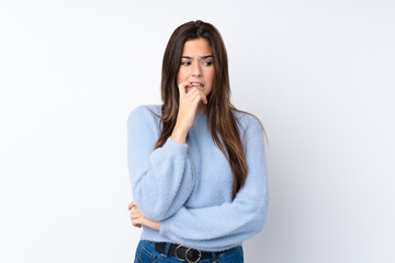 Teenager girl over isolated white background nervous and scared